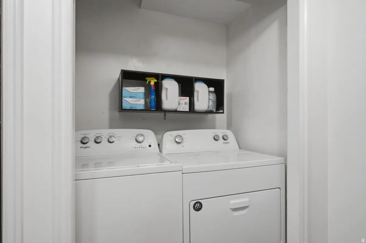 Laundry area featuring a built-in wall shelf