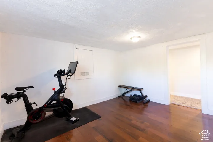 Hardwood-style flooring throughout, with natural light, and overhead lighting