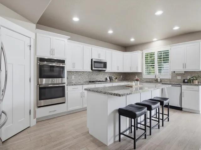 Kitchen features a DOUBLE OVEN and a BREAKFAST BAR