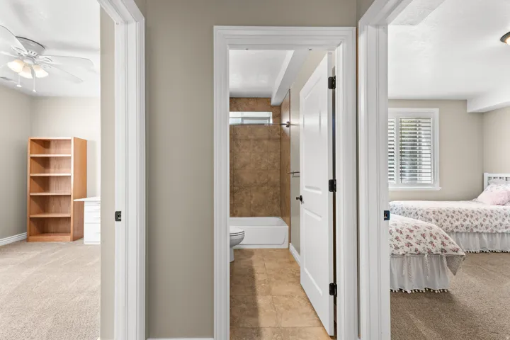 Thoughtfully designed suite featuring multiple rooms with white trim and neutral wall finishes