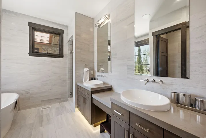 Dual vanity with vessel sinks and wall-mounted faucets