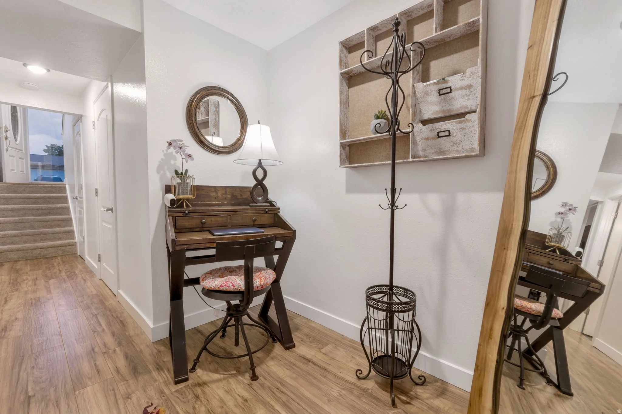 Wood-finish flooring throughout the hallway