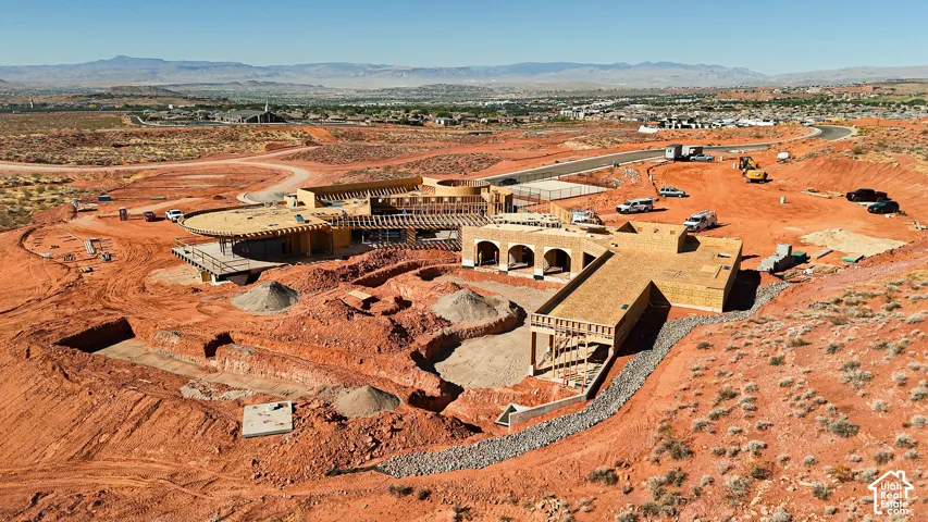 Expansive property featuring a multi-structure building envelope, established road infrastructure, and significant excavation work underway