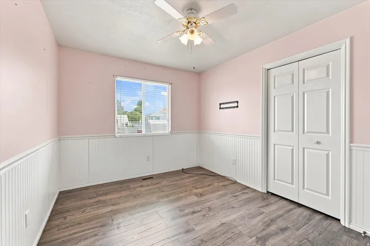 Wood-finish flooring with white wainscoting
