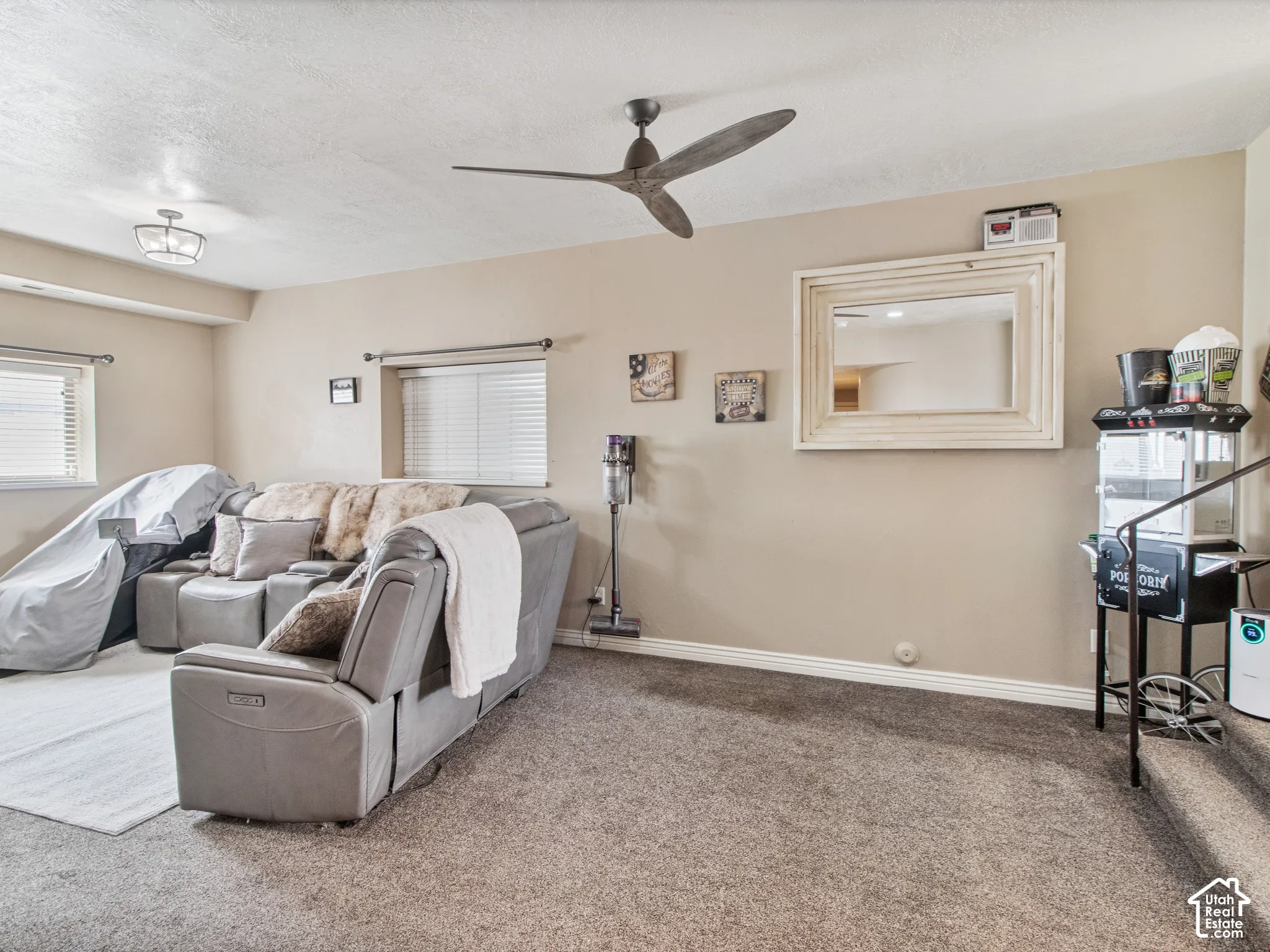 TV room. Recessed ceiling light fixture and a contemporary ceiling fan