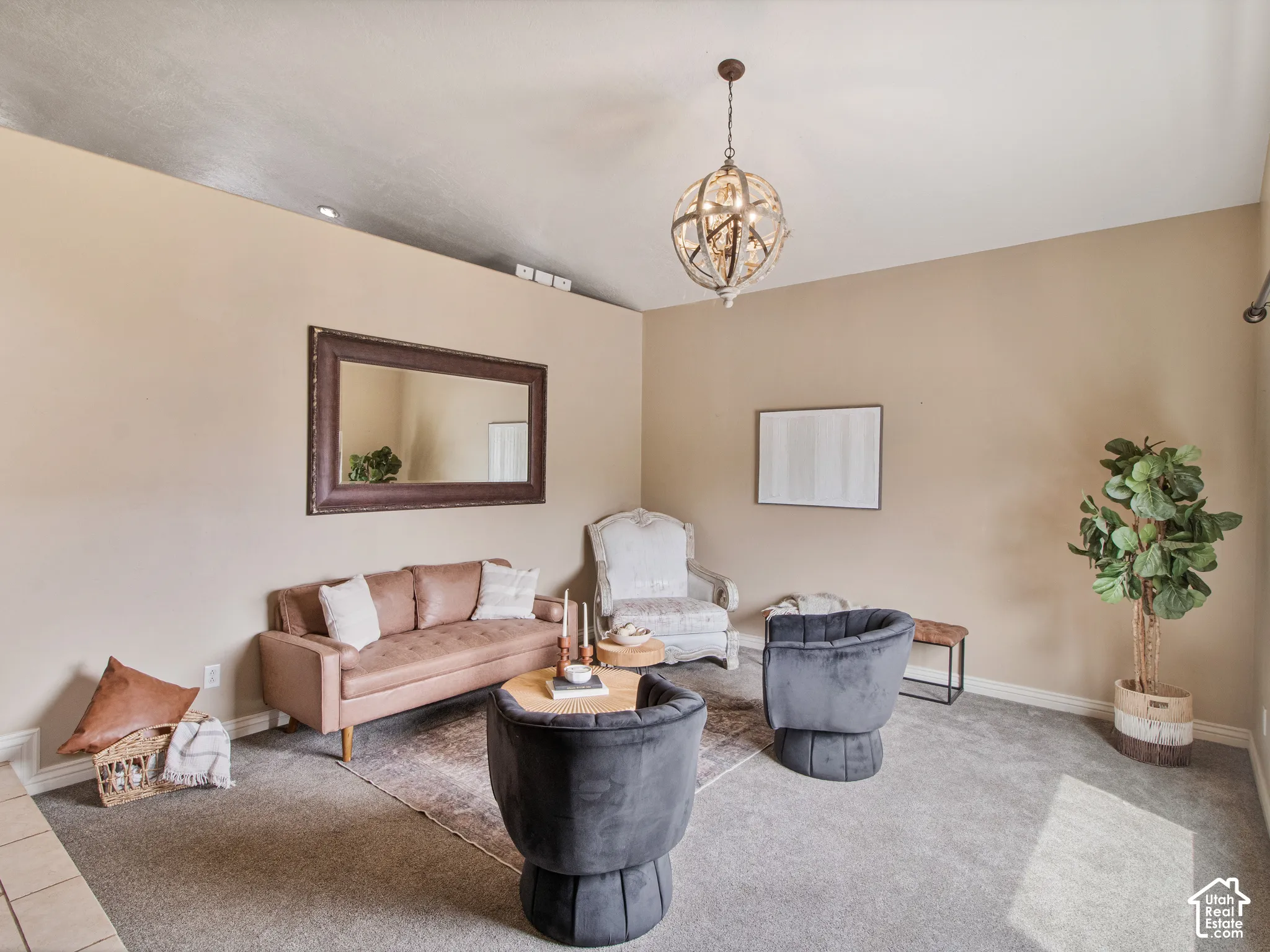 Formal living room. High ceilings with a decorative spherical chandelier and recessed lighting