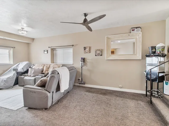 TV room. Recessed ceiling light fixture and a contemporary ceiling fan