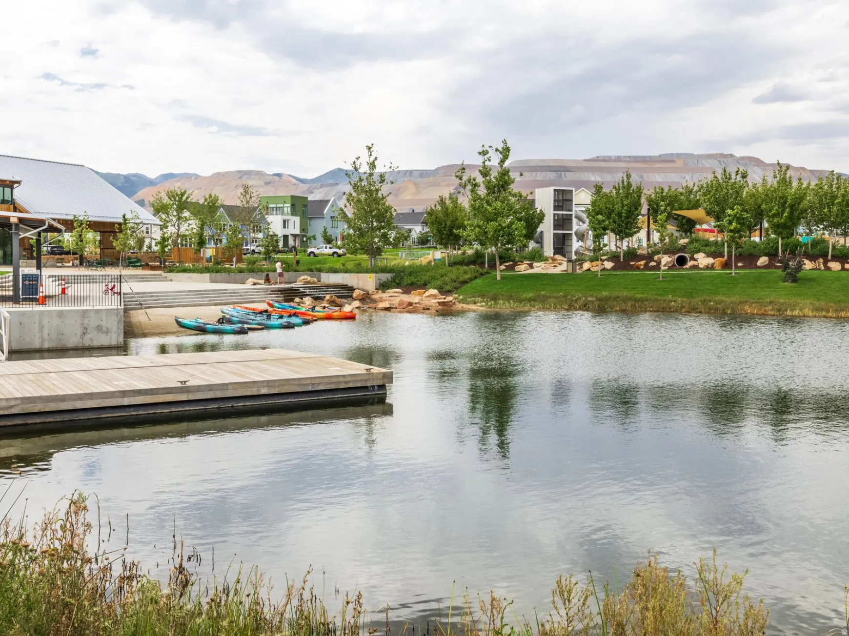 Expansive water feature with a wooden dock and a concrete landing