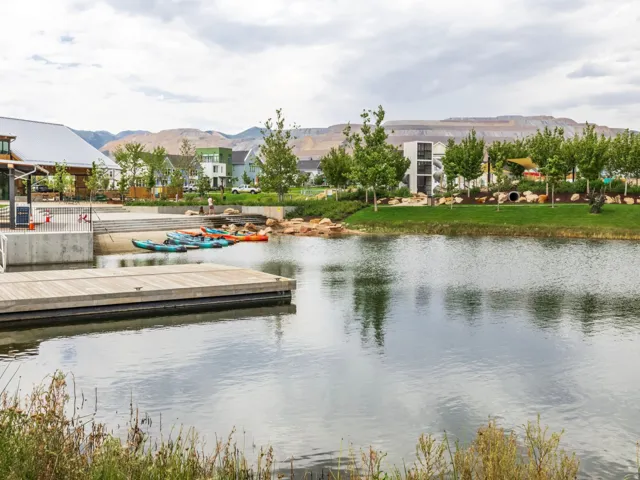 Expansive water feature with a wooden dock and a concrete landing