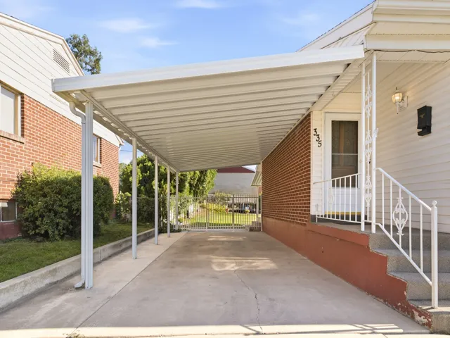 Attached carport providing covered parking
