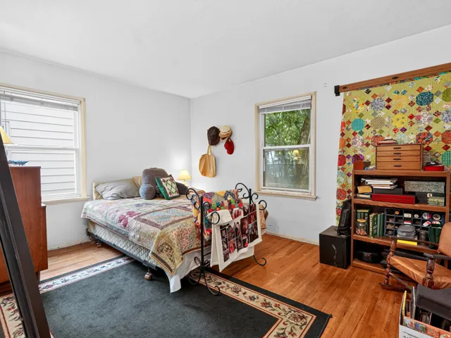 Hardwood flooring and dual windows with natural light