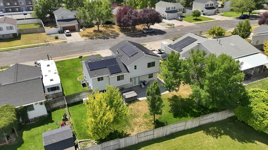 Aerial view of manicured lawn and solar panels
