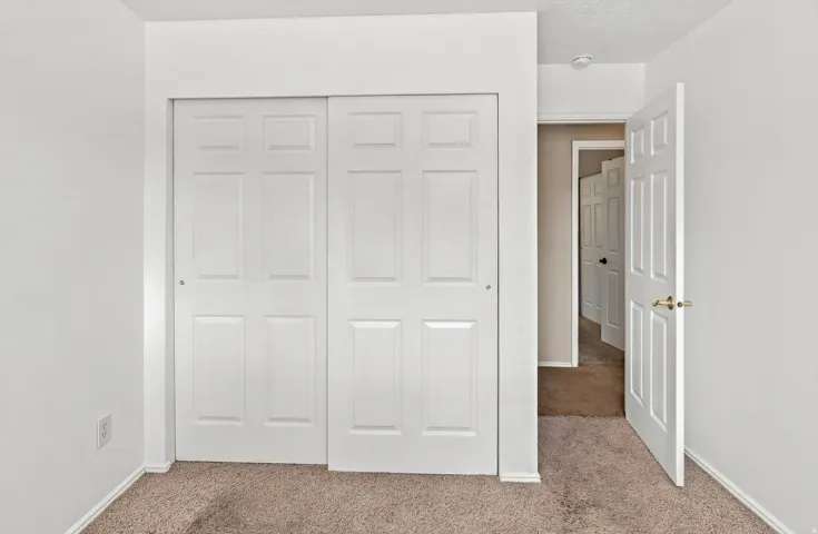 Bedroom #3 view toward closet and door.