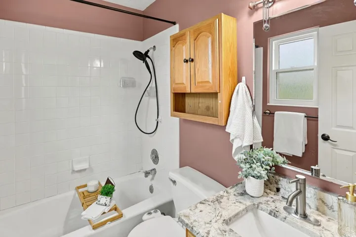En suite private bathroom next to primary bedroom