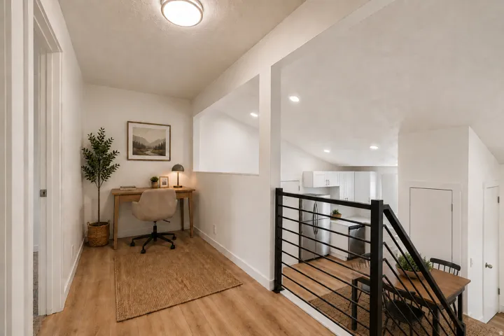 Wood-finish flooring throughout, with a contemporary black metal railing