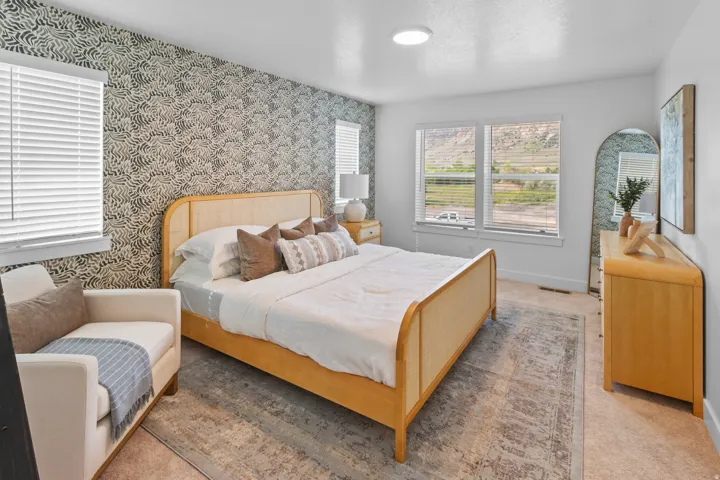 Accent wall featuring a detailed patterned wallpaper