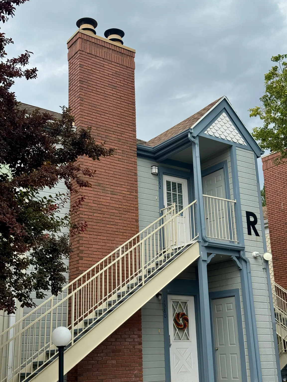Brick chimney with decorative caps
