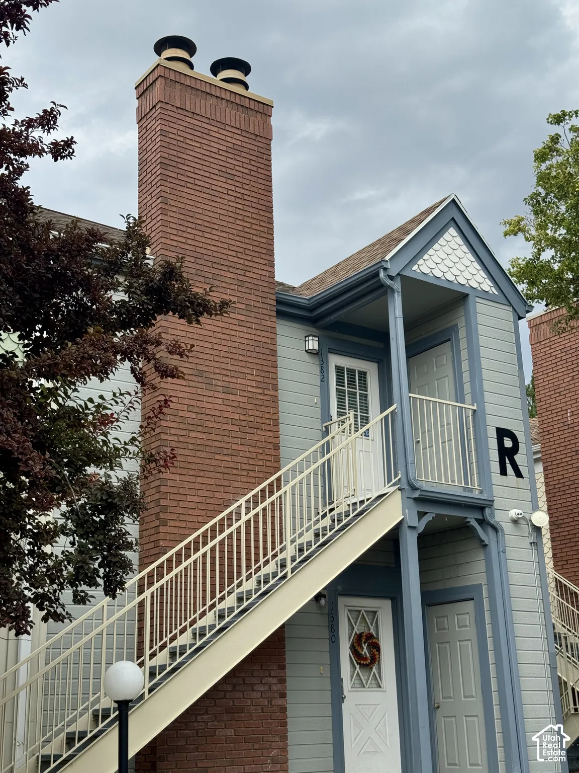 Brick chimney with decorative caps