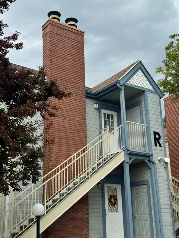 Brick chimney with decorative caps