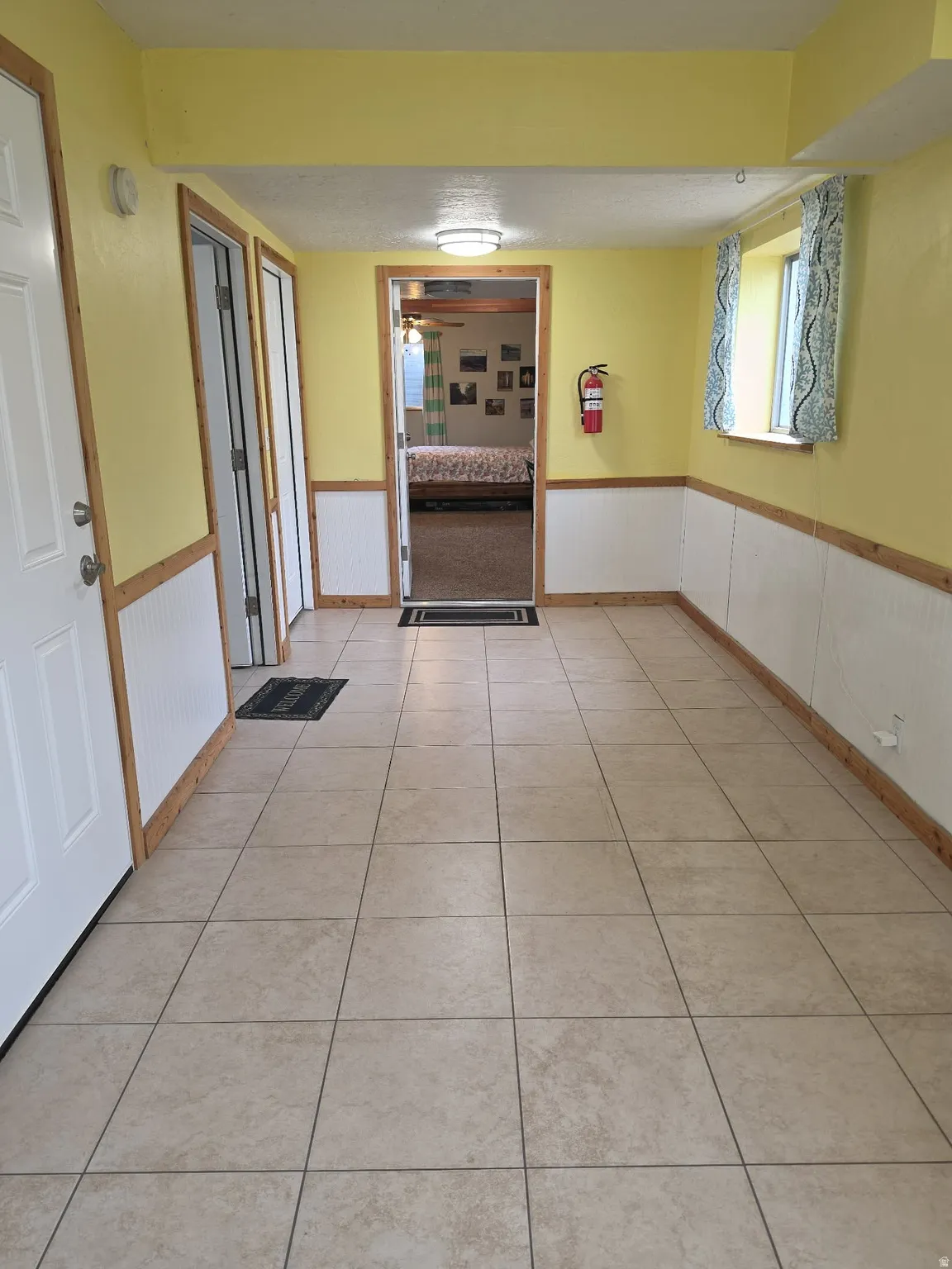 Tile flooring and wainscoting with wood trim
