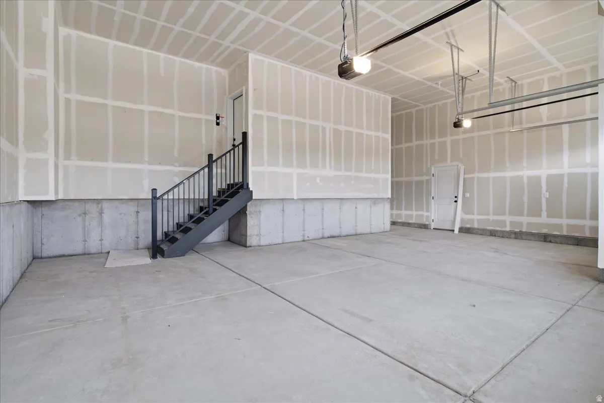 Spacious Garage.  Space Saving Stairs and  Extra High Ceilings