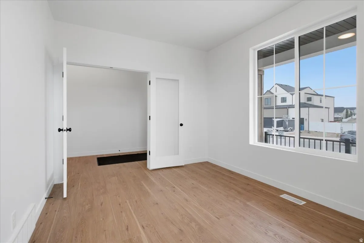 Office with double doors and large windows. Perfect for remote work.