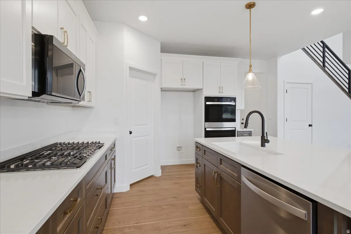 Double Ovens and 5 Burner Gas Cooktop