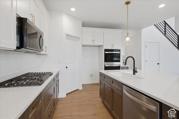 Double Ovens and 5 Burner Gas Cooktop