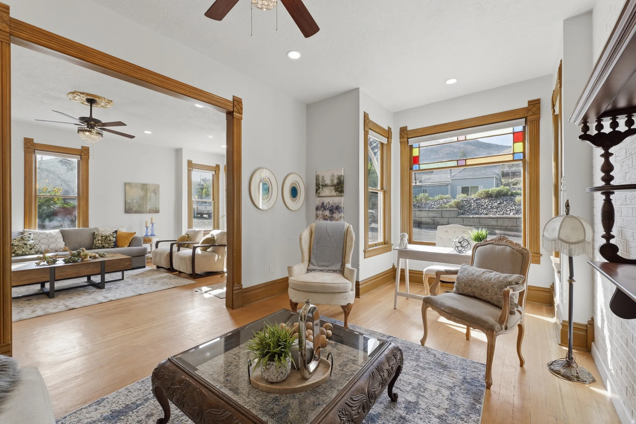 Hardwood flooring throughout, with stained wood trim and door frames
