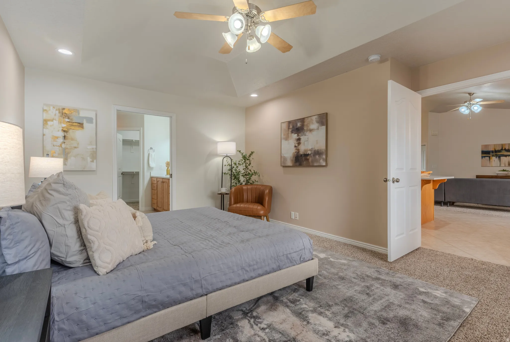 Primary Bedroom. Vaulted ceiling with a ceiling fan, recessed lighting, and carpet flooring
