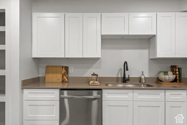 White shaker cabinetry with dark hardware
