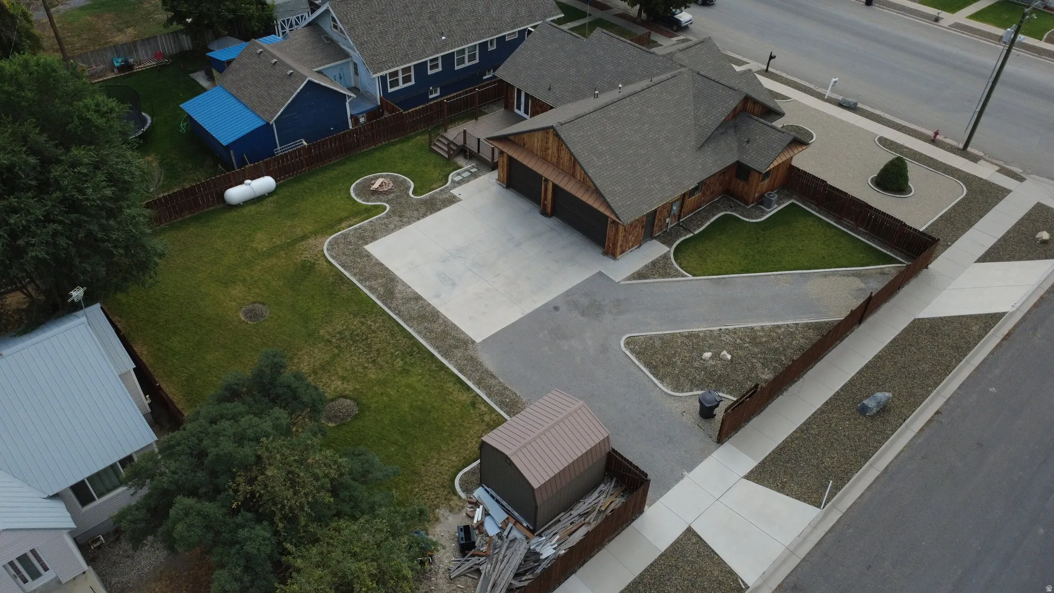 Single-story residence featuring a multi-gabled roofline and wood siding