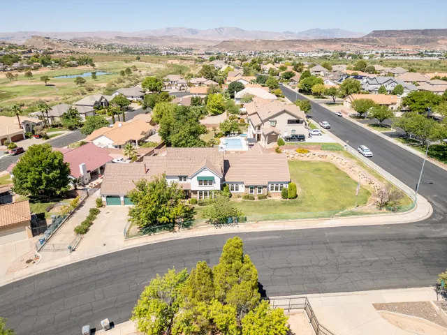 Expansive property featuring a large backyard, mature landscaping, and an integrated swimming pool