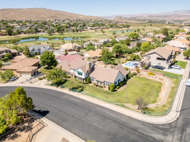 Expansive property featuring a large backyard, mature landscaping, and a substantial residential structure