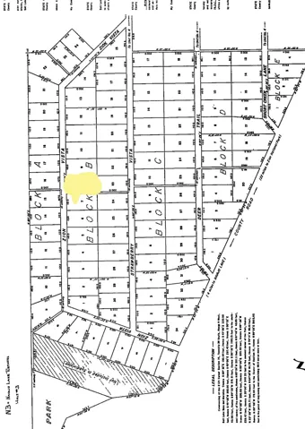 Subdivision Plat Map. Depicting the parceled land divisions and lot configurations for the property, with one lot highlighted in yellow