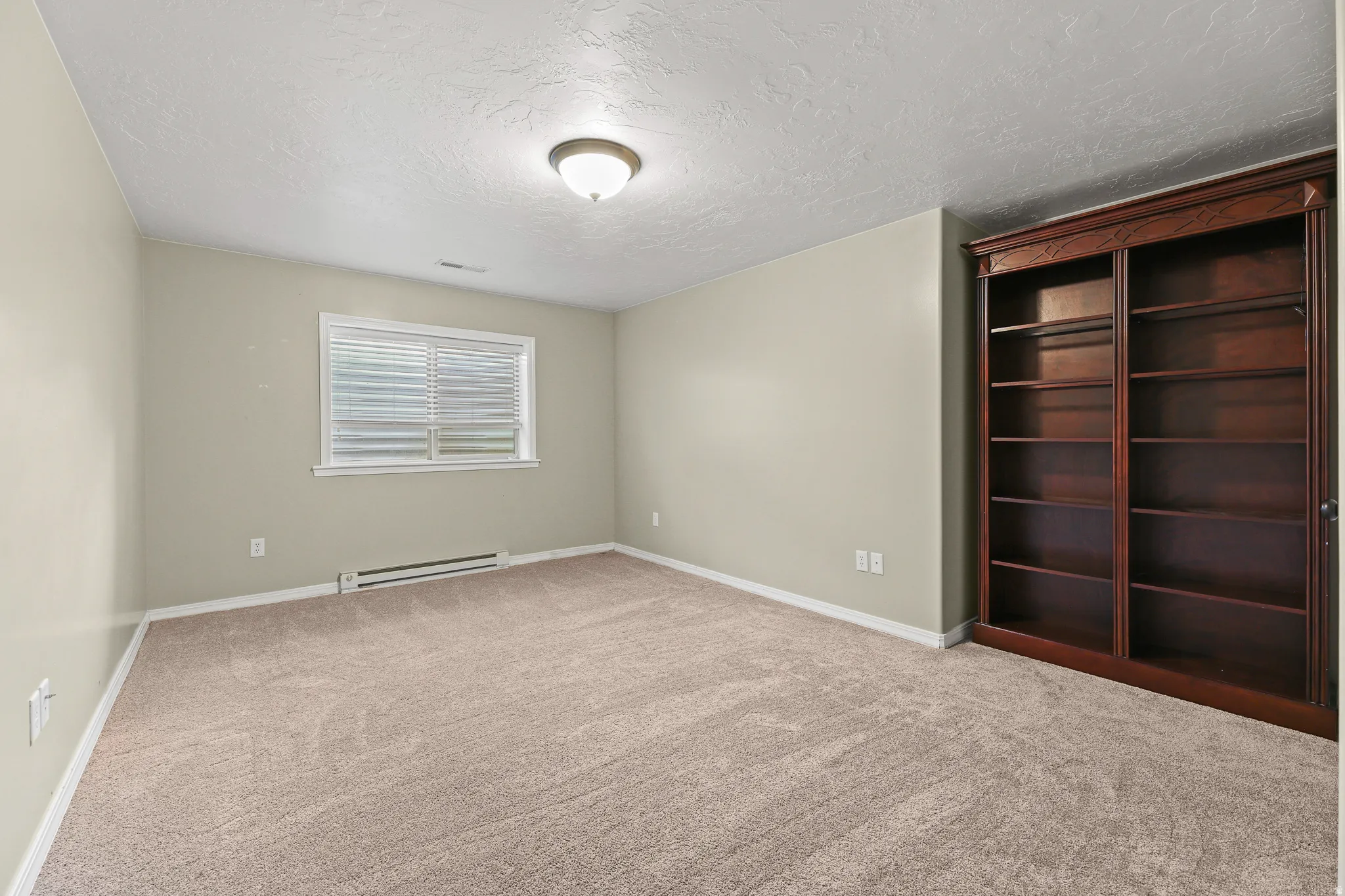 Neutral-toned wall paint with carpet flooring