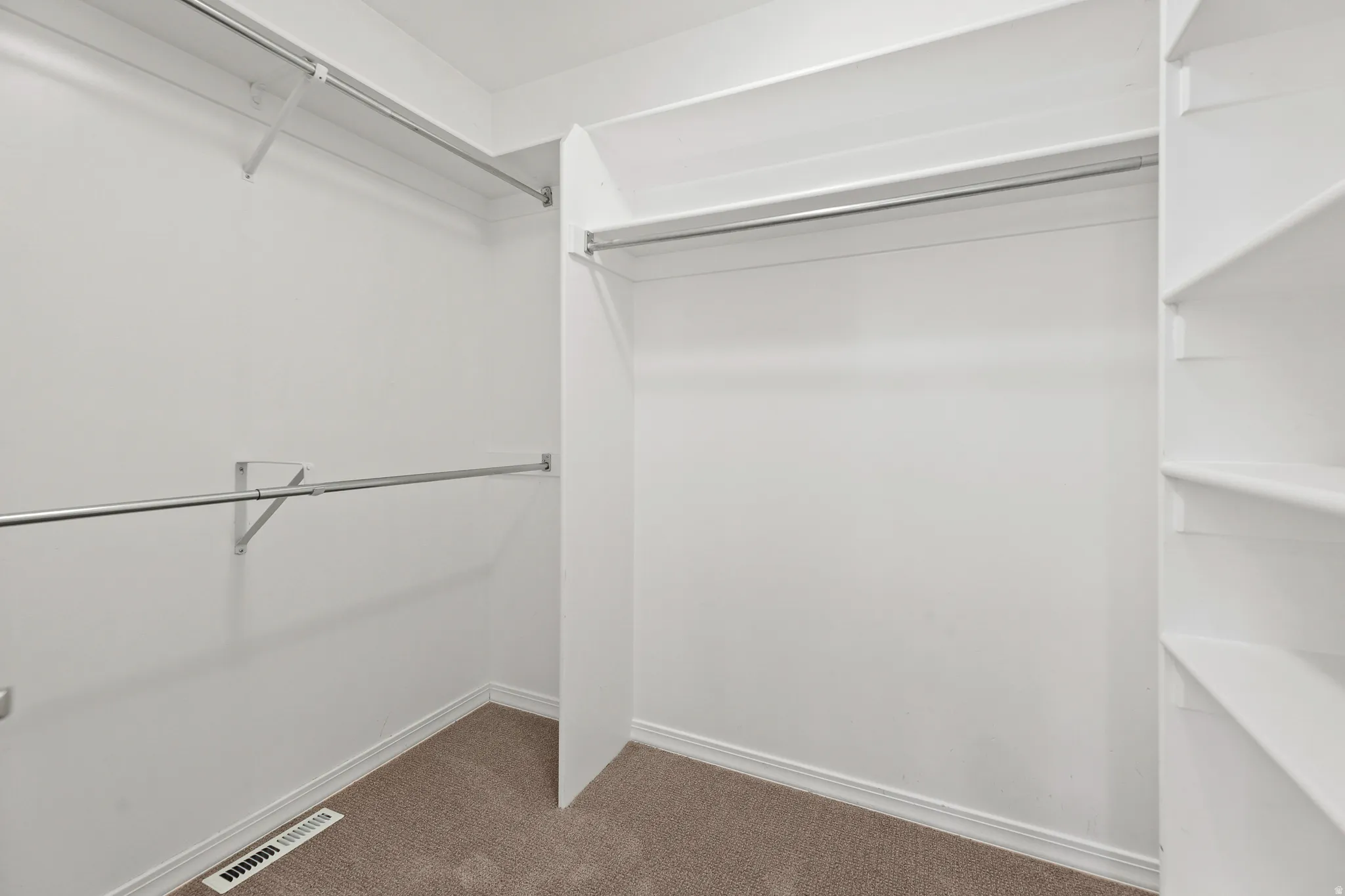 Integrated shelving system featuring multiple storage tiers and chrome hanging rods