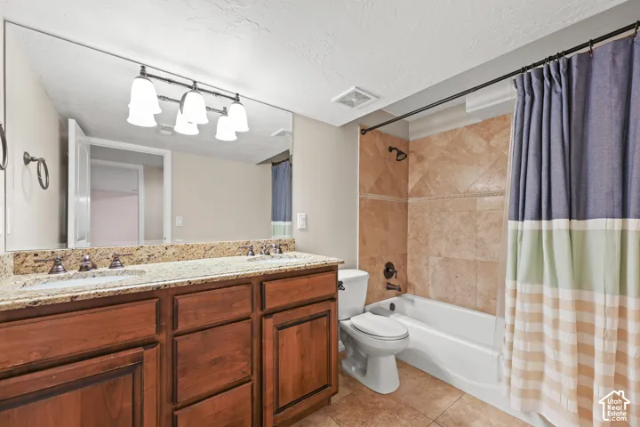 Double vanity with integrated sinks and granite countertop