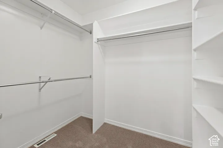 Integrated shelving system featuring multiple storage tiers and chrome hanging rods