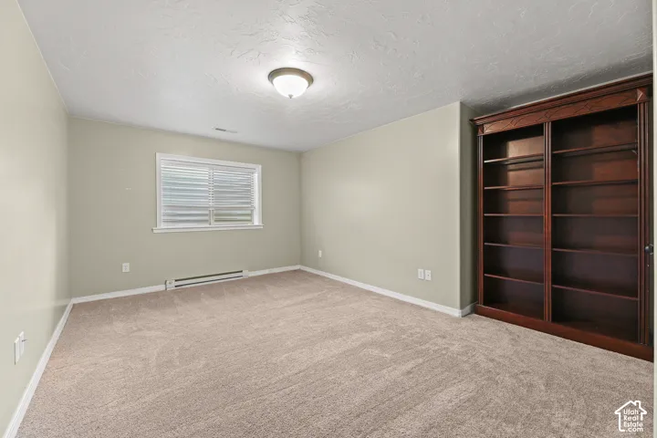 Neutral-toned wall paint with carpet flooring