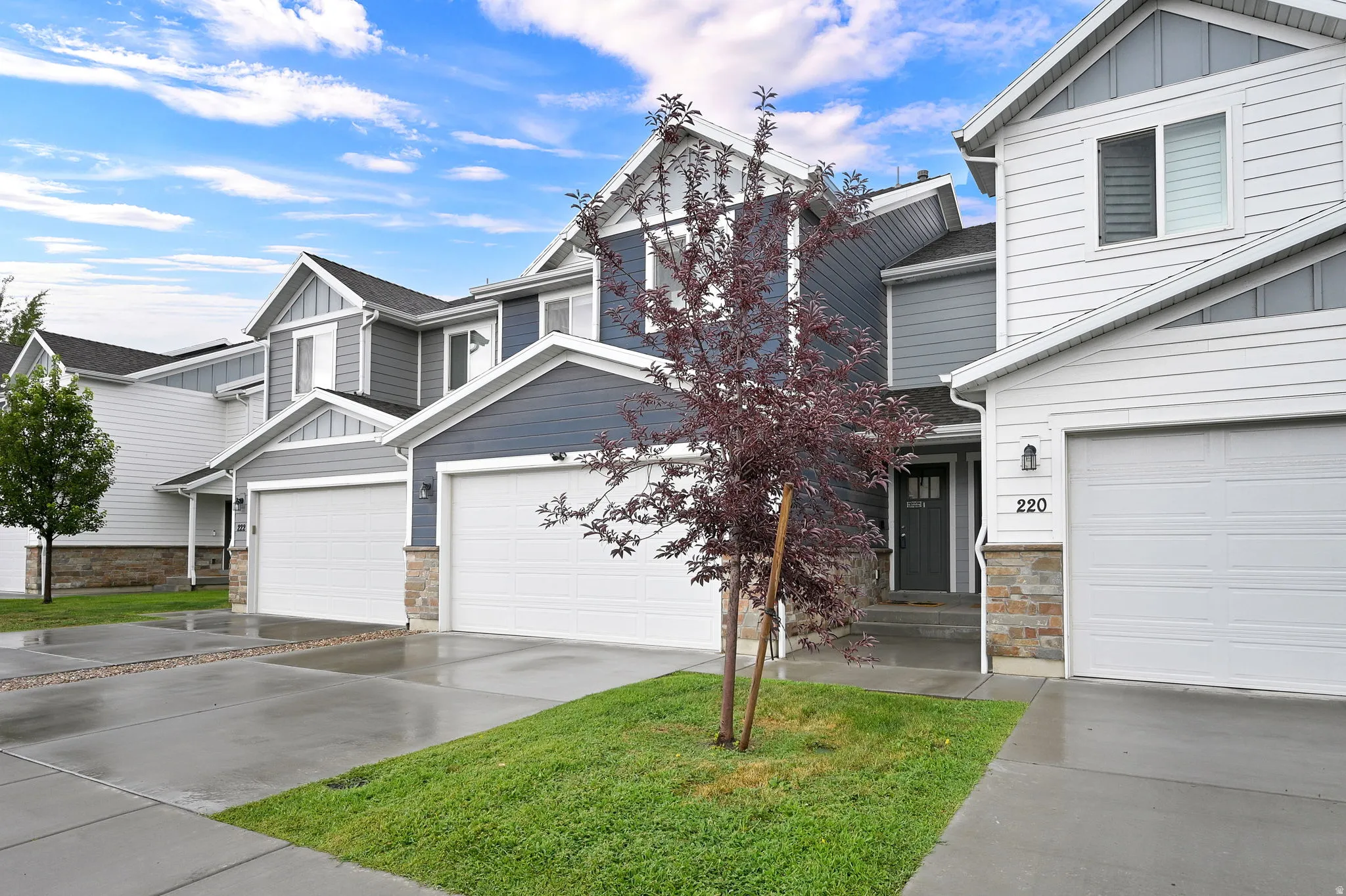 Welcome to this two-story residence featuring a clean, contemporary exterior