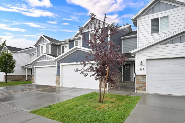 Welcome to this two-story residence featuring a clean, contemporary exterior