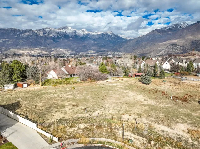View of property highlighted with mountain backdrop