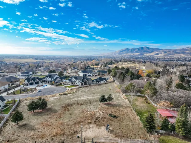 Aerial view of residential area featuring a mountainous background