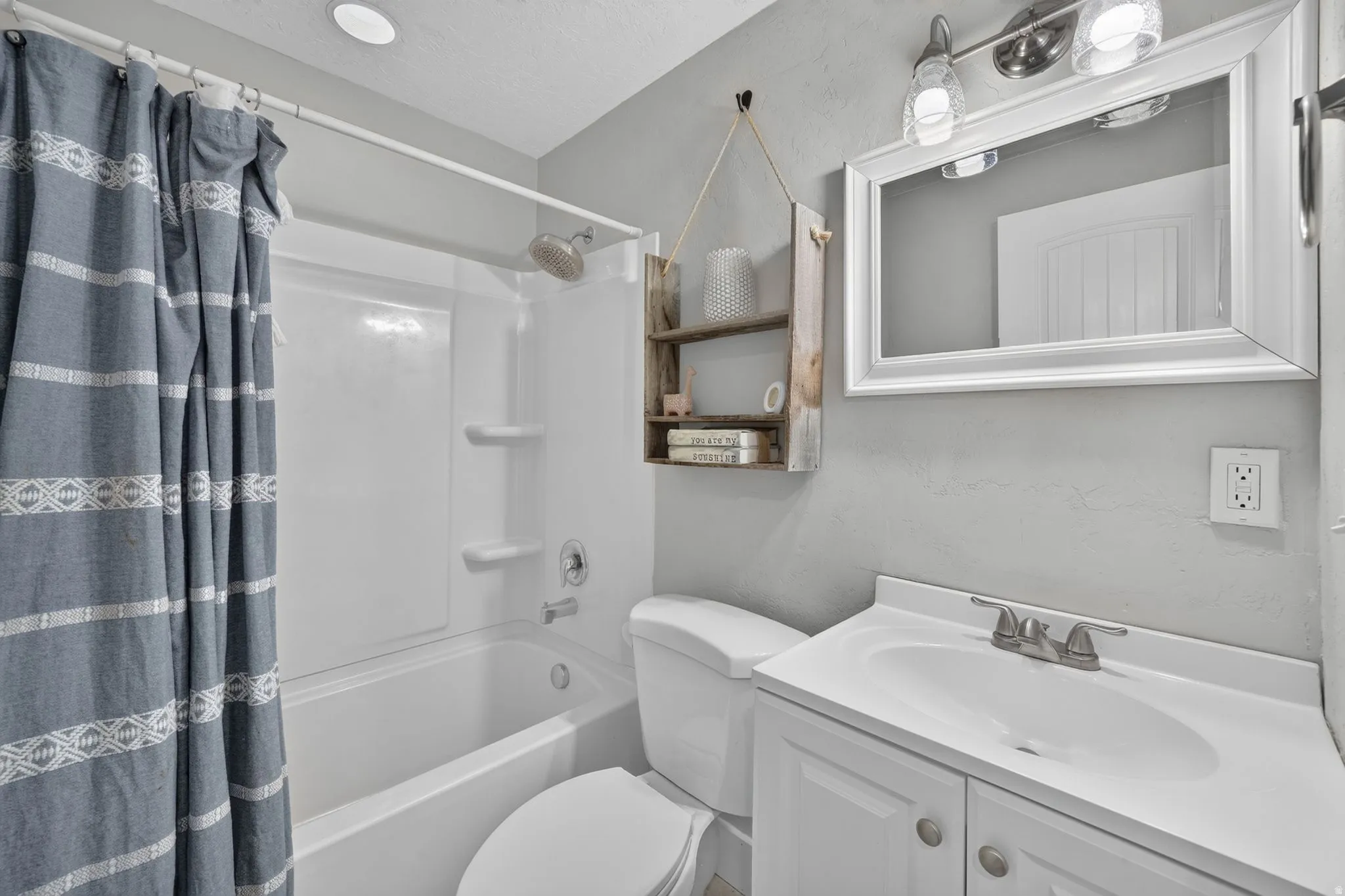 White vanity with brushed nickel hardware
