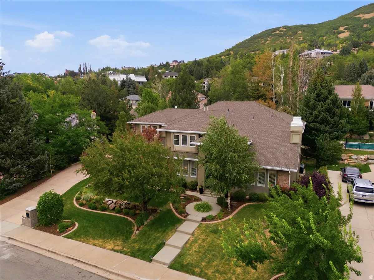 Two-story residence with a multi-gabled roof and brick accents