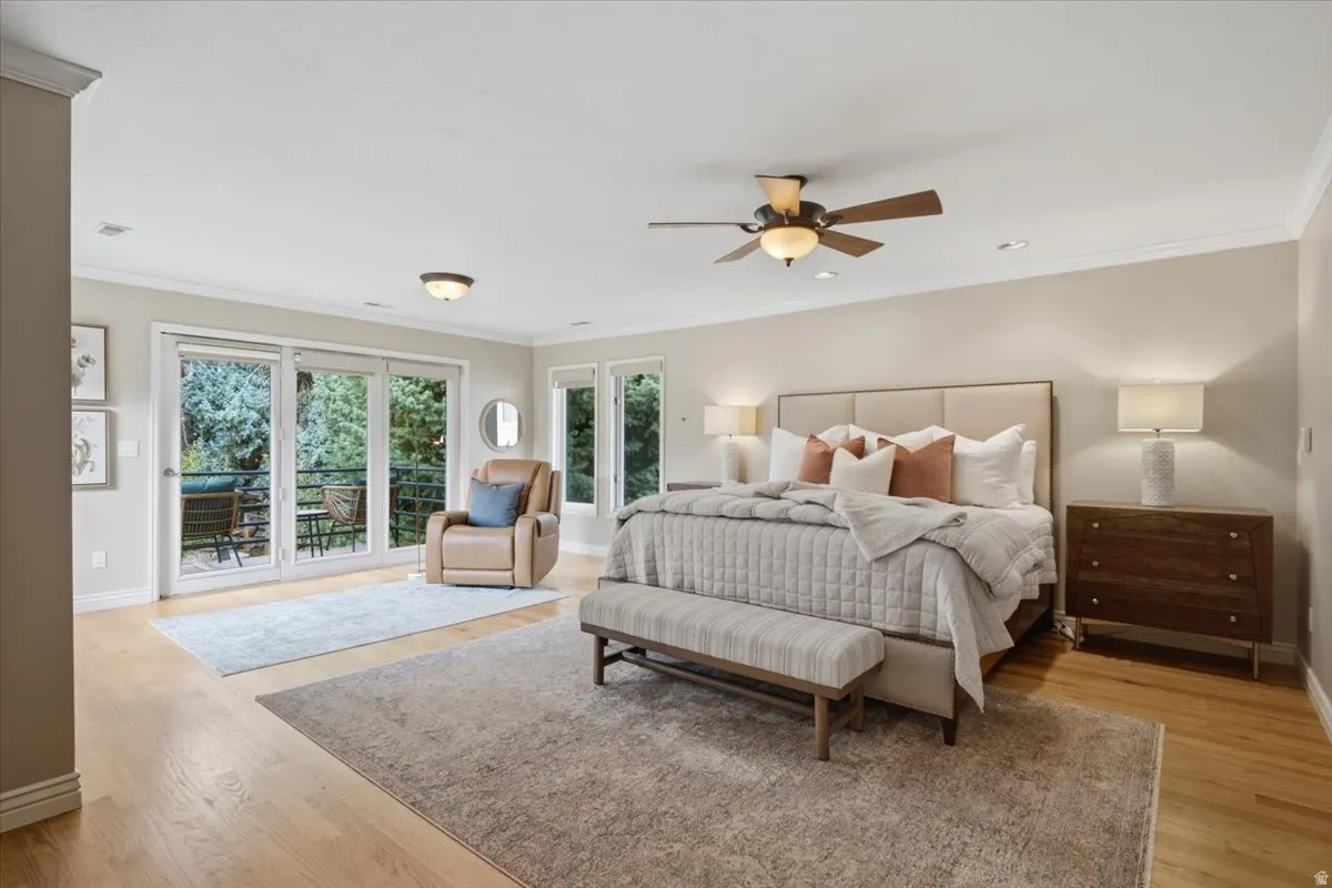 Hardwood flooring throughout, with a ceiling fan and recessed lighting