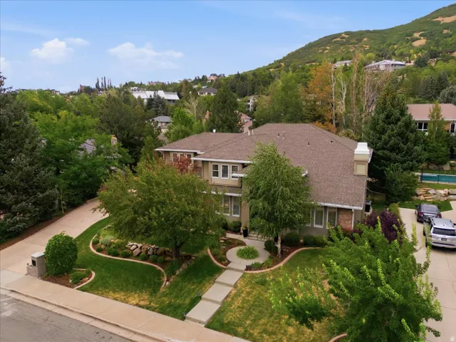 Two-story residence with a multi-gabled roof and brick accents