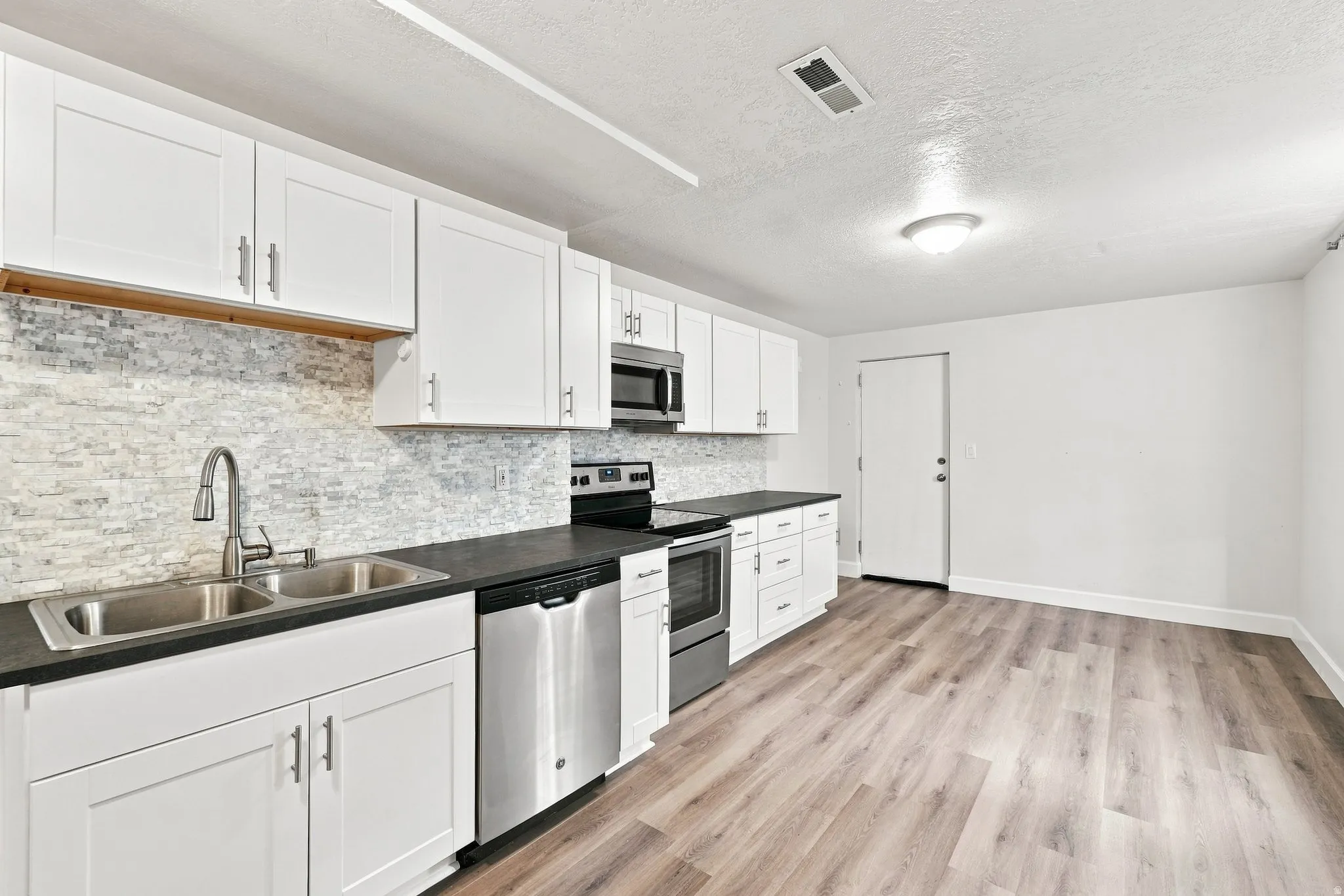 White cabinets and lovely tile backsplash
