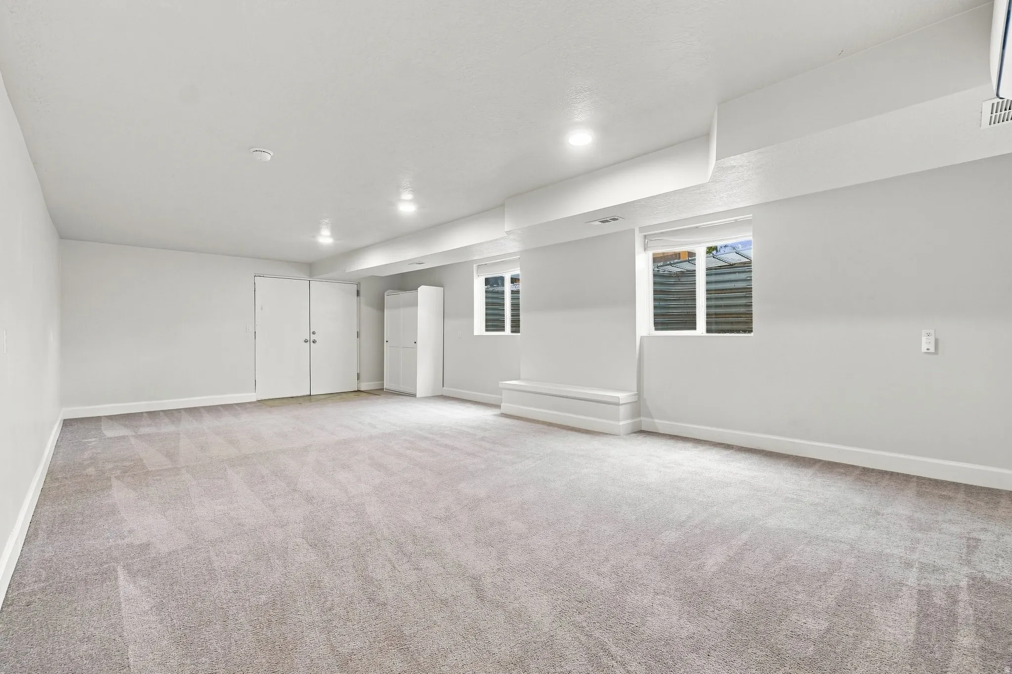 Exterior doors in the basement. Large windows bring in lots of light.